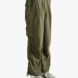 Green pants worn by a person, showing the pants fit