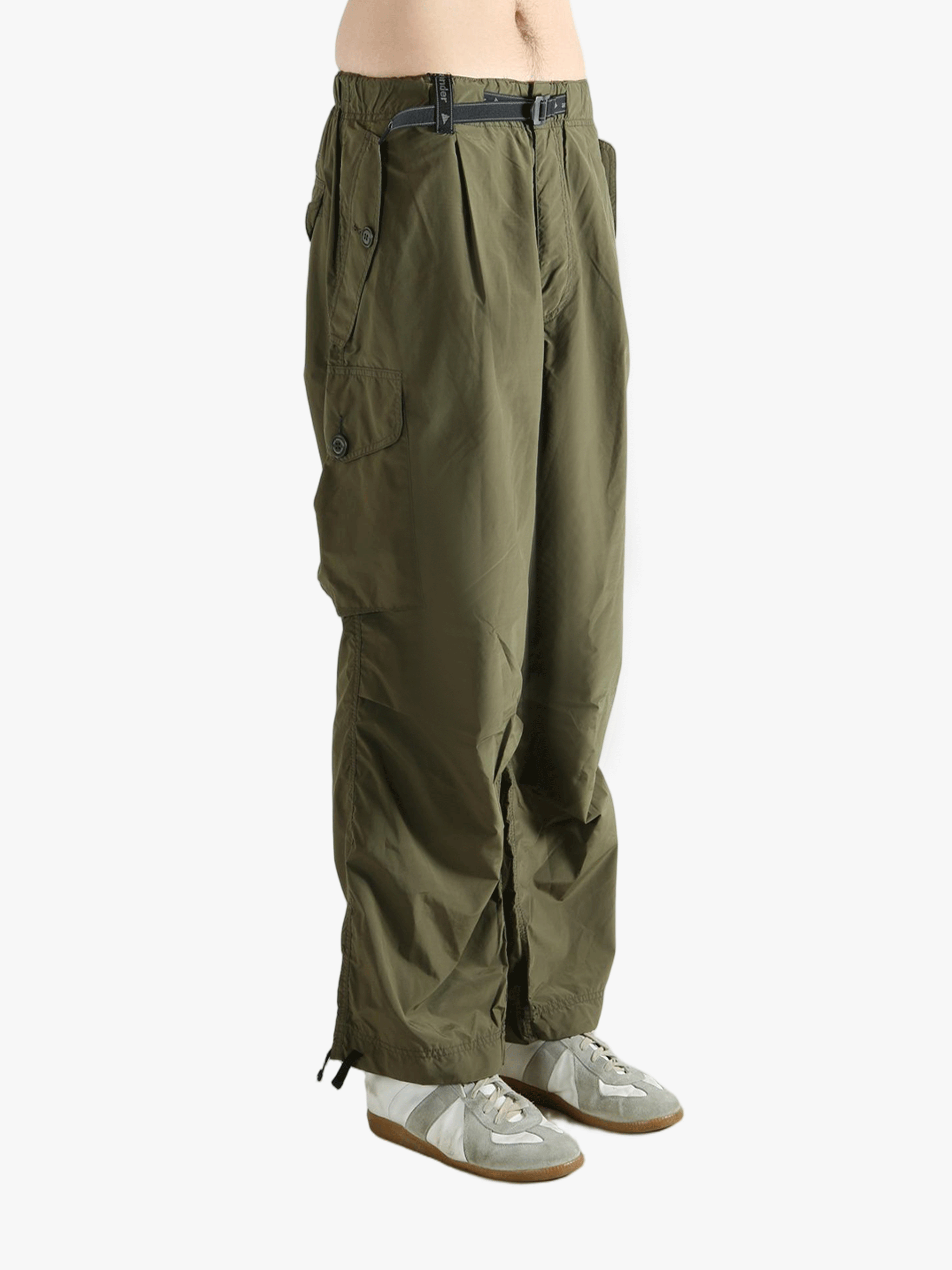 Green pants worn by a person, showing the pants fit