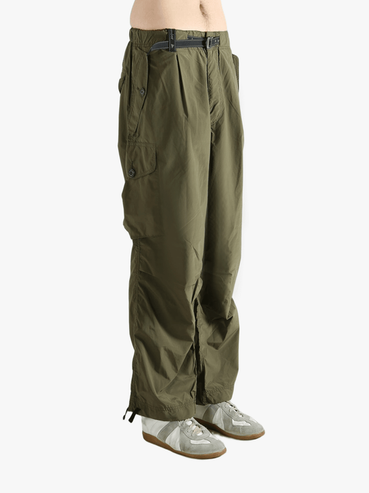 Green pants worn by a person, showing the pants fit