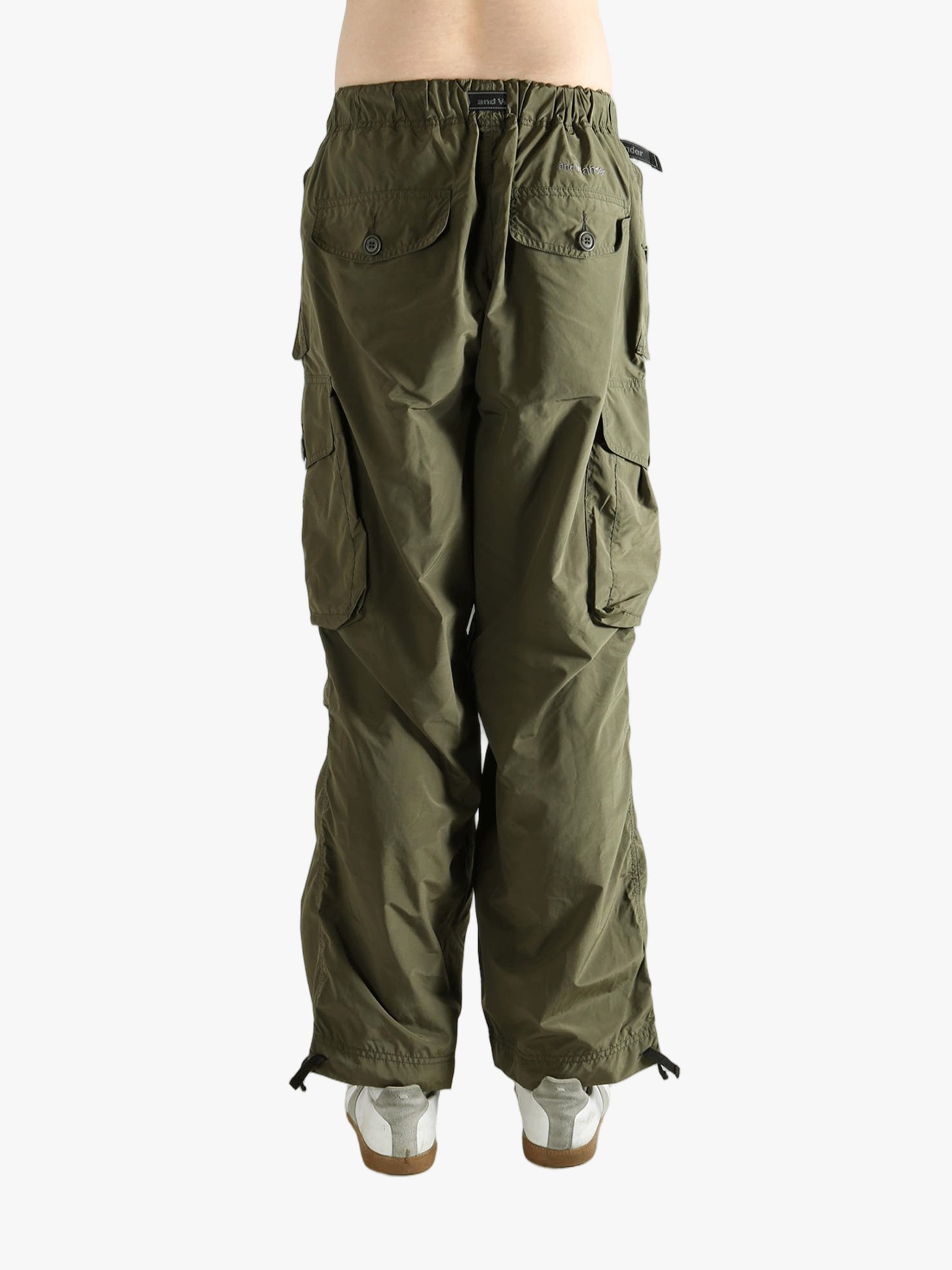 Green pants worn by a person, showing the pants fit