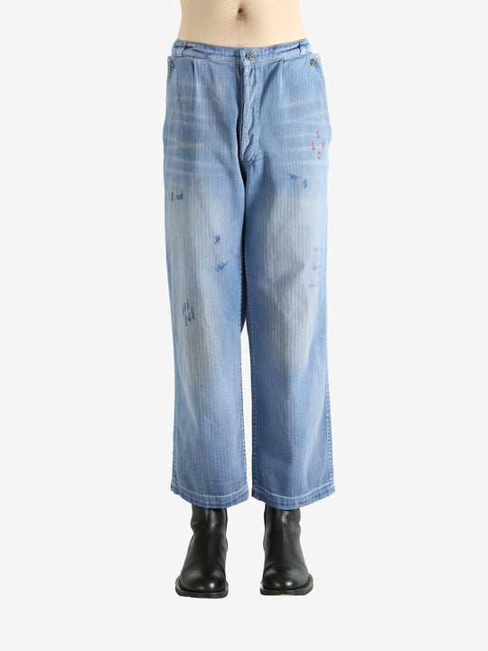 Blue pants worn by a person, showing the pants' fit