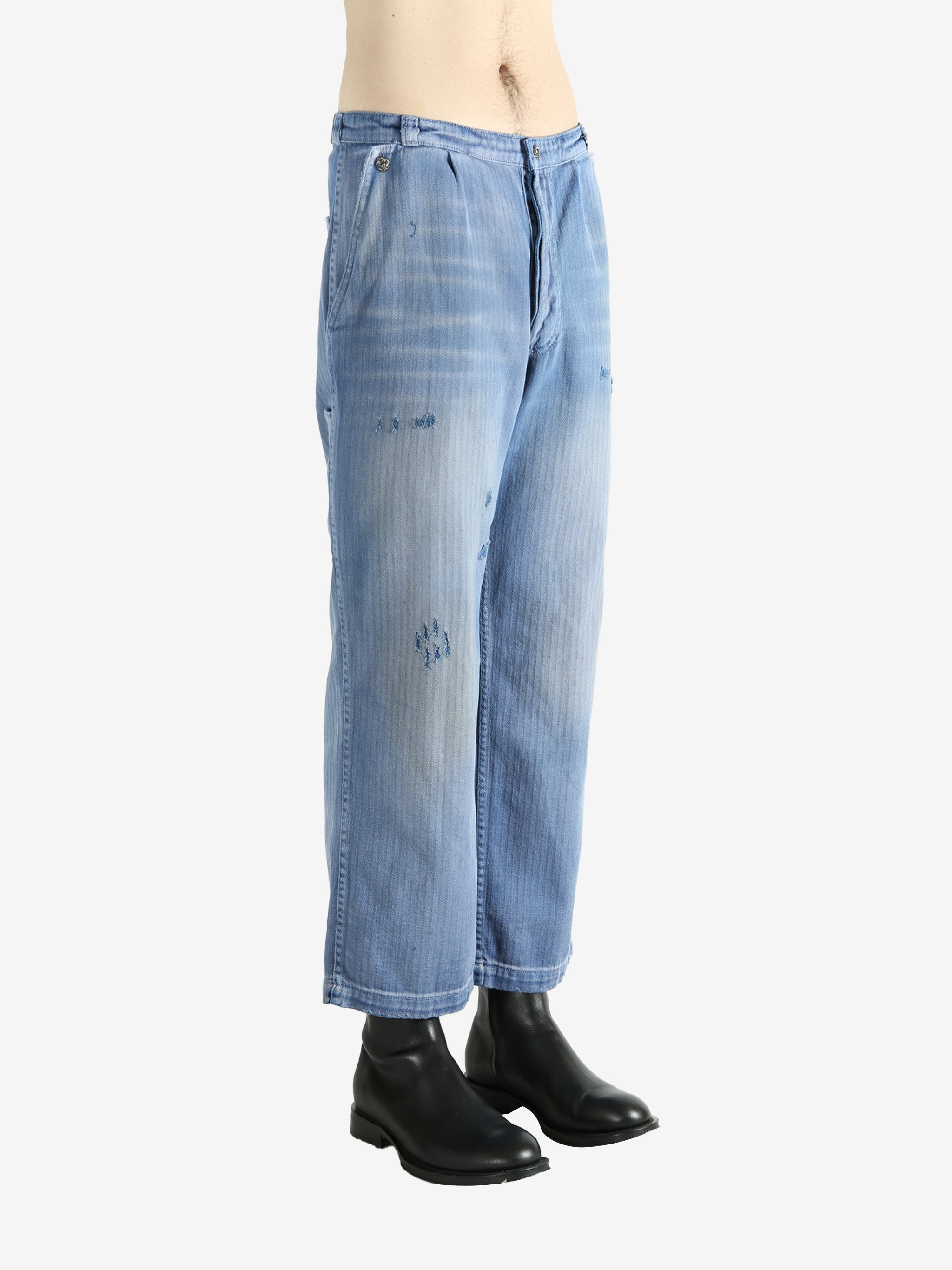 Blue pants worn by a person, showing the pants' fit