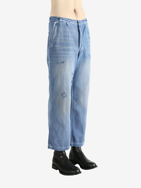 Blue pants worn by a person, showing the pants' fit