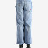 Blue pants worn by a person, showing the pants' fit