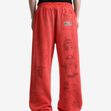 Red pants worn by a person, showing the pants fit