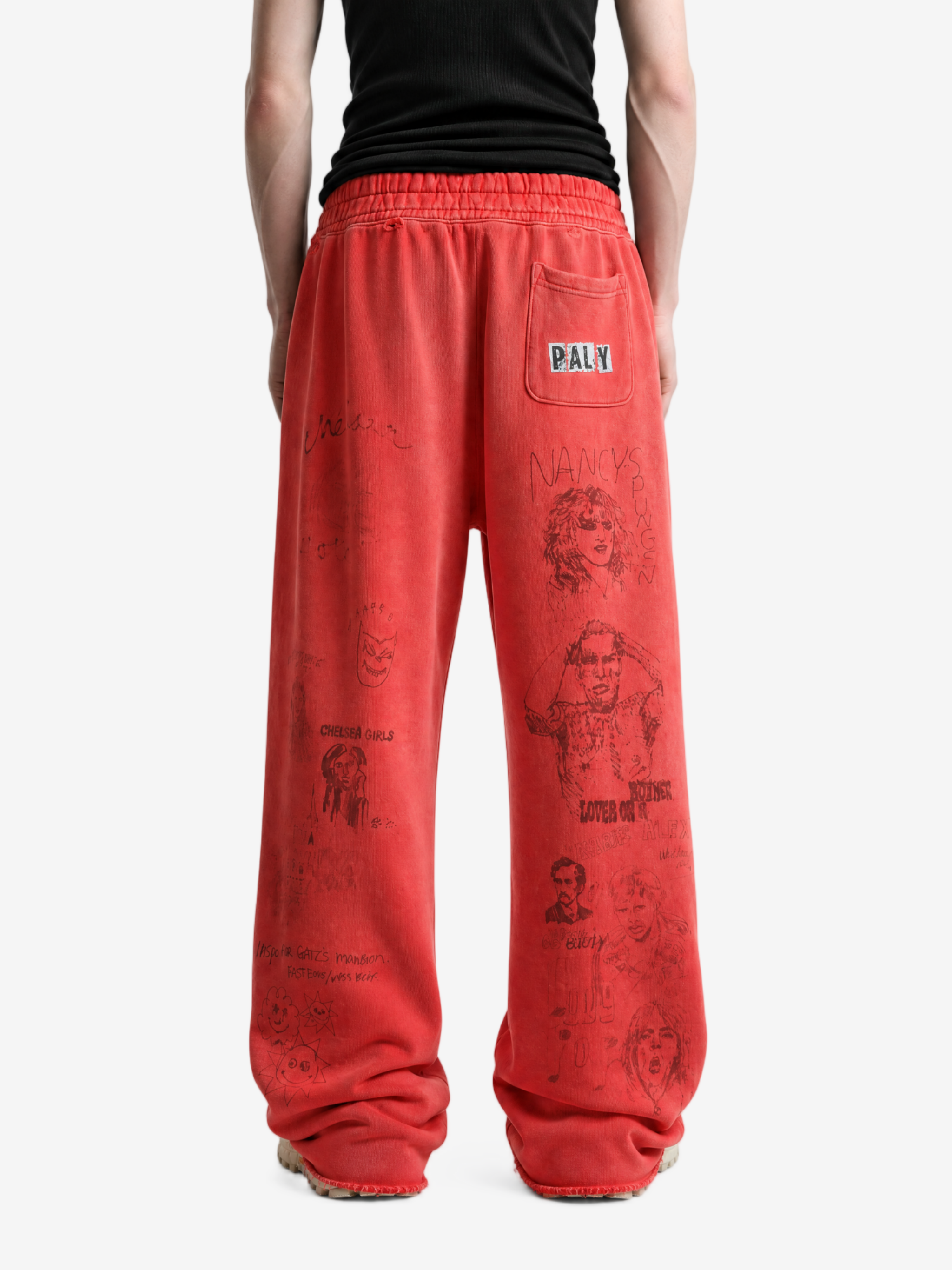 Red pants worn by a person, showing the pants fit