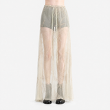 tan skirt worn by a person, showing the skirt  fit