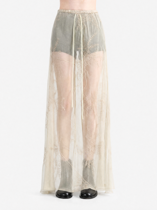 tan skirt worn by a person, showing the skirt  fit