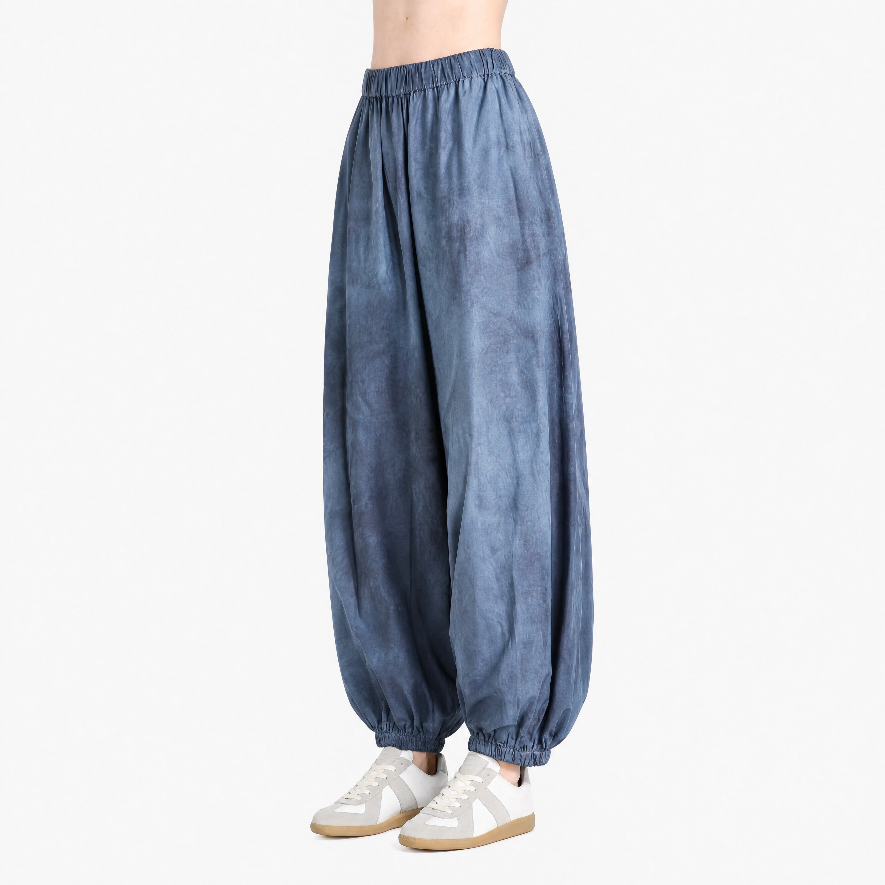 Blue pant worn by a person, showing the pant fit