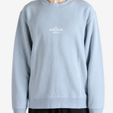 Grey hoodie worn by a person, showing the hoodie fit