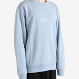 Grey hoodie worn by a person, showing the hoodie fit