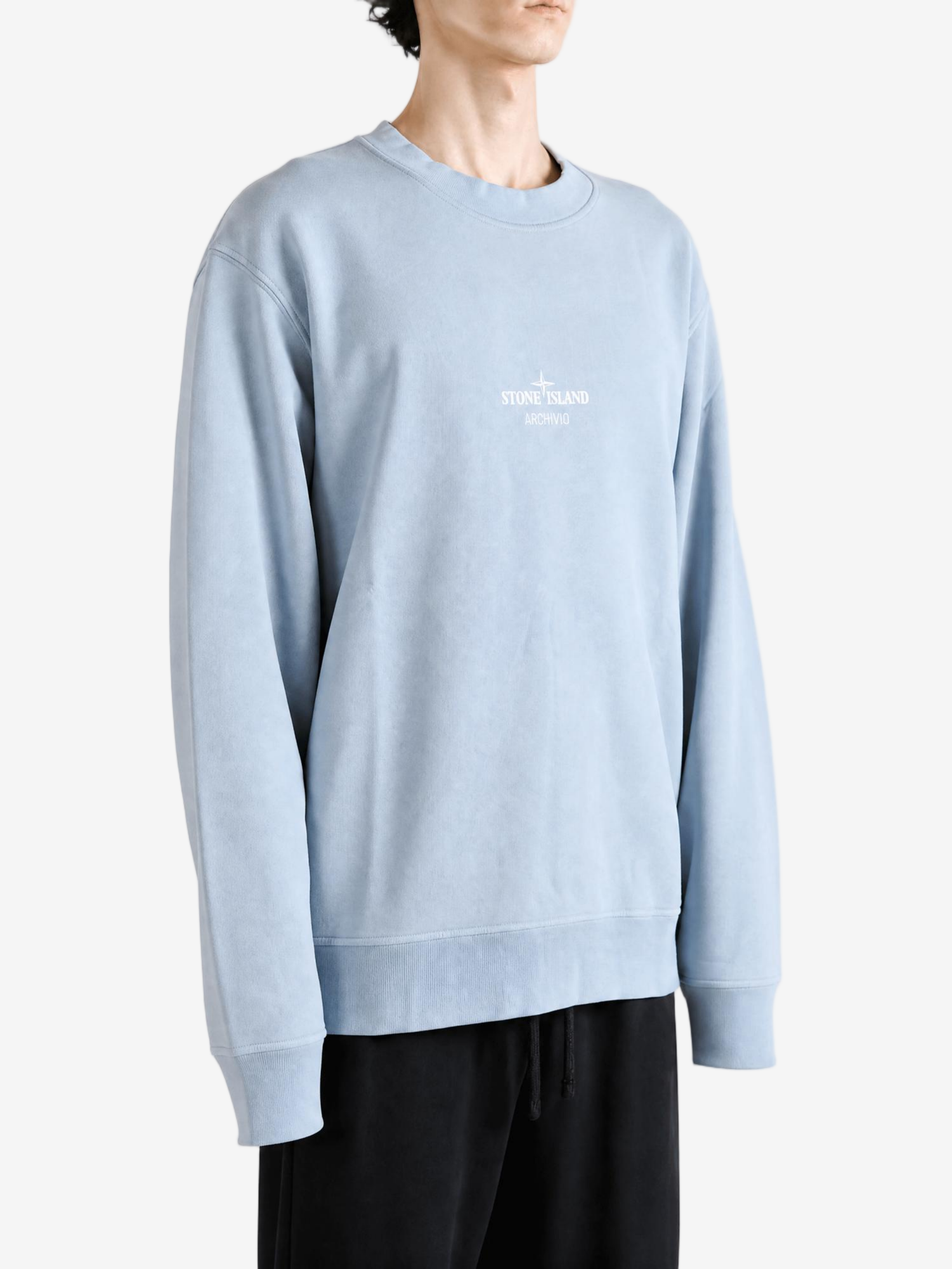 Grey hoodie worn by a person, showing the hoodie fit