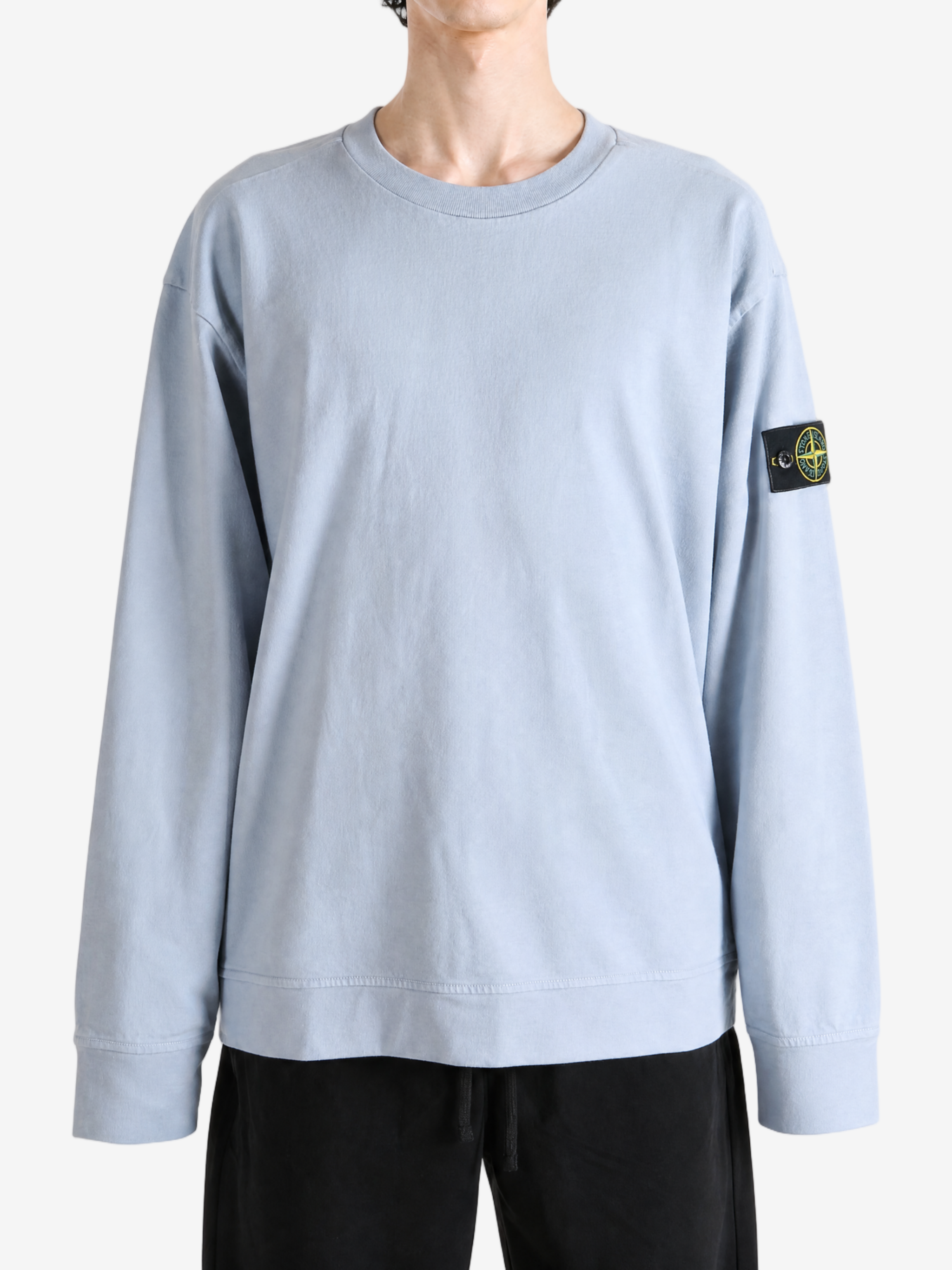Grey hoodie worn by a person, showing the hoodie fit