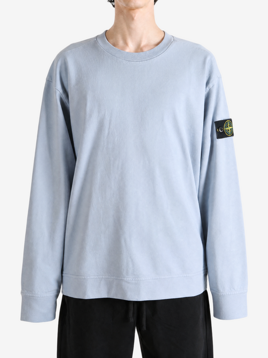 Grey hoodie worn by a person, showing the hoodie fit