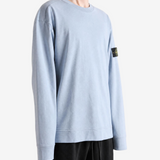 Grey hoodie worn by a person, showing the hoodie fit