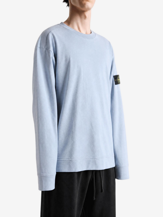 Grey hoodie worn by a person, showing the hoodie fit