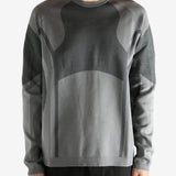 grey  sweater worn by a person, showing the sweater's fit