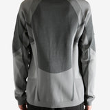 grey  sweater worn by a person, showing the sweater's fit