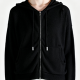 Black hoodie worn by a person, showing the hoodie fit