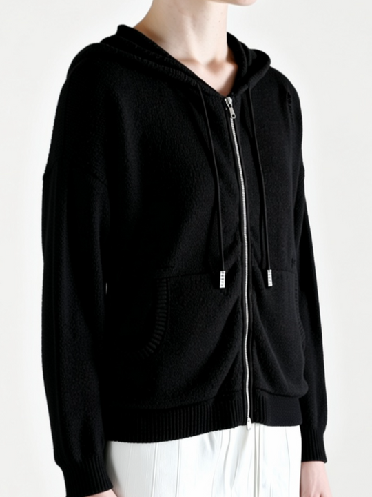 Black hoodie worn by a person, side view