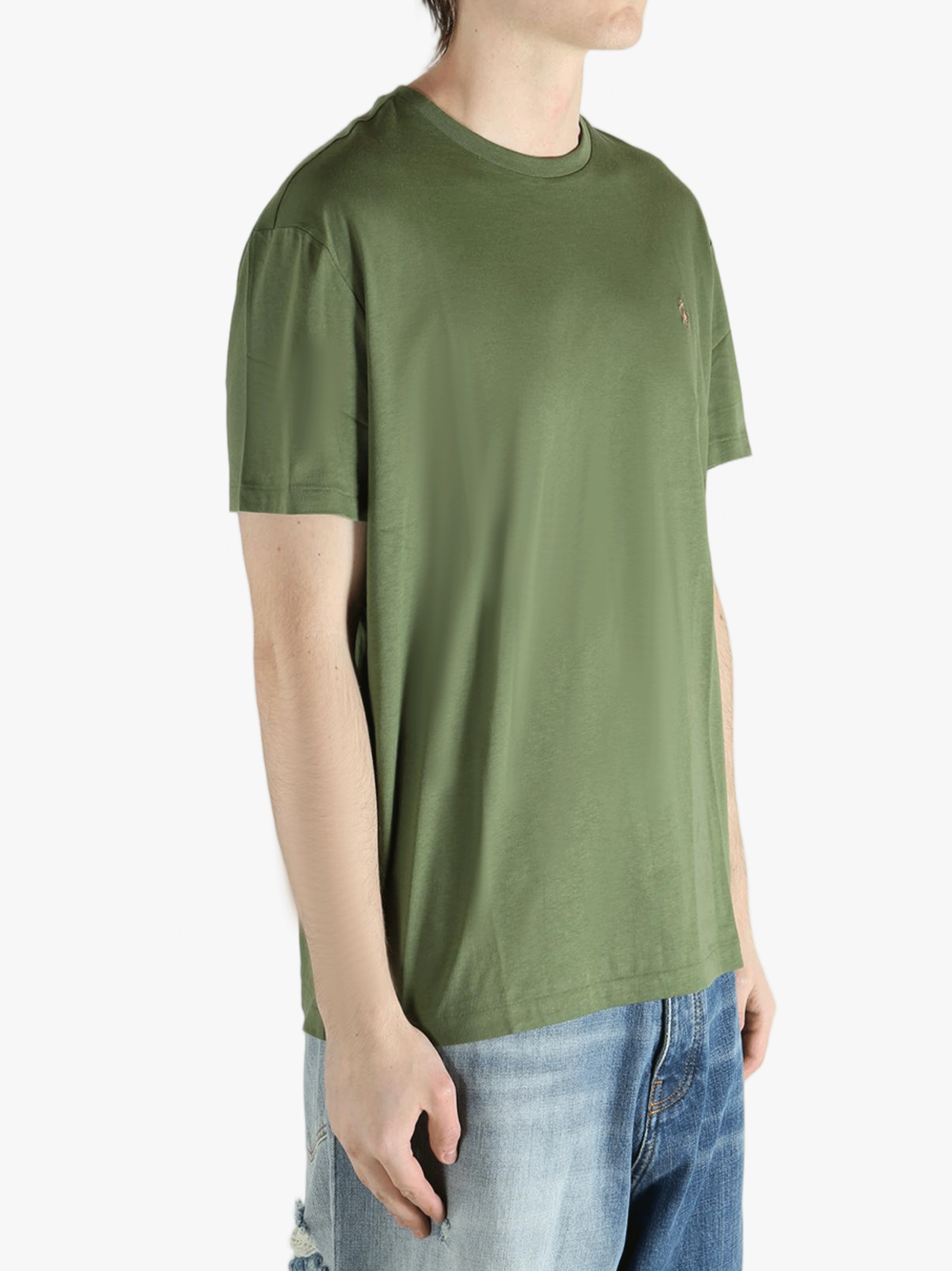 Green t-shirt worn by a person, showing the t-shirt's fit