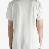 White shirt worn by a person, showing the shirt's fit