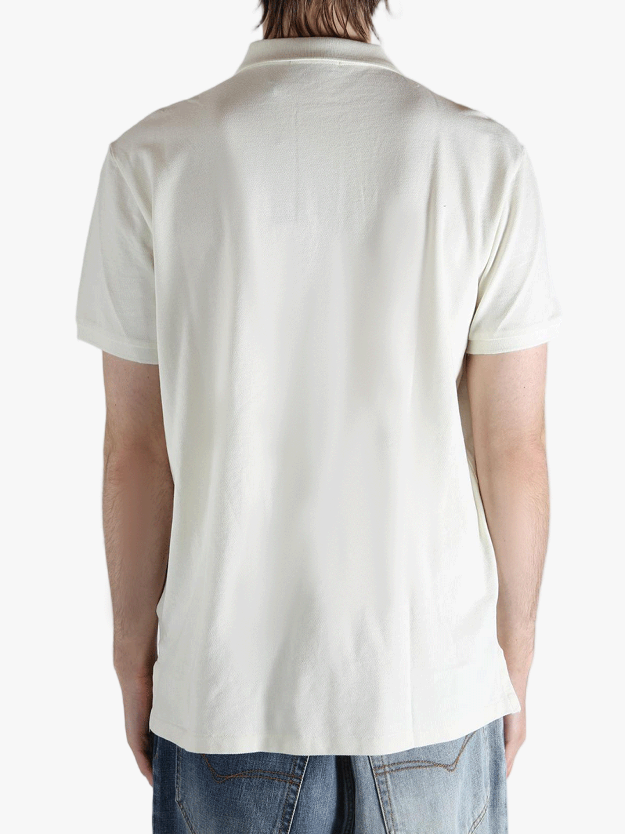 White shirt worn by a person, showing the shirt's fit