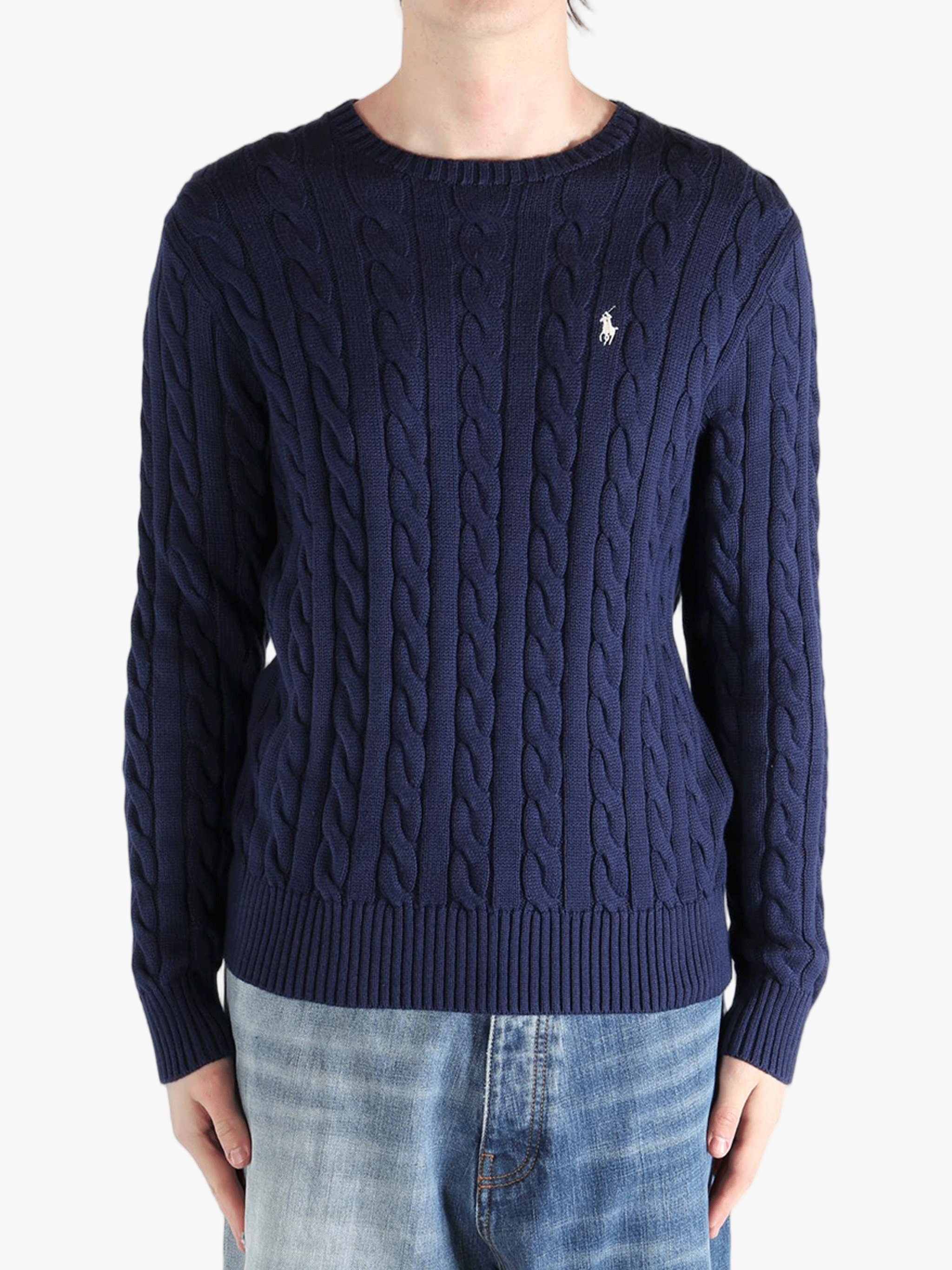 Navy sweater worn by a person, showing the sweater's fit