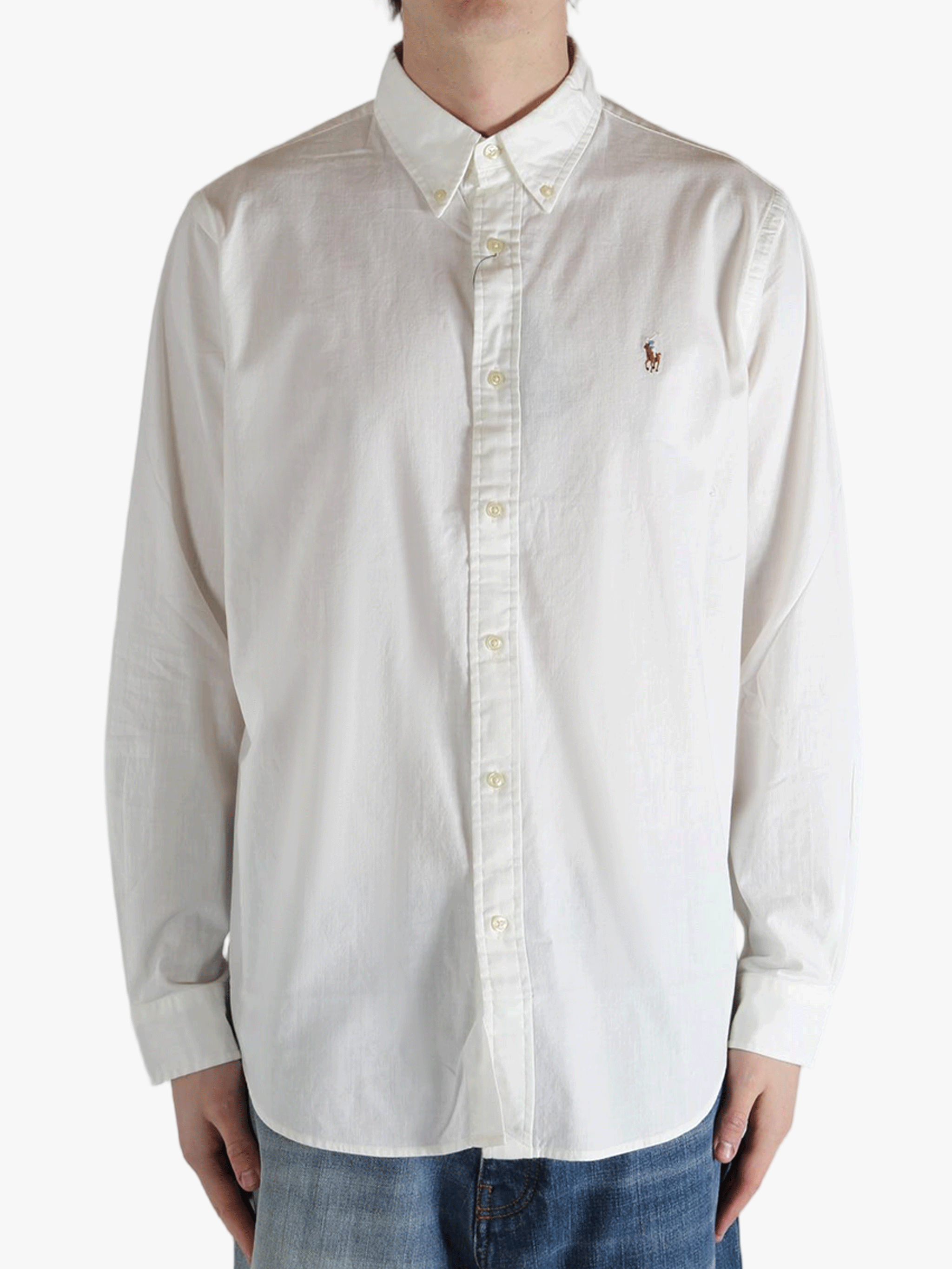 White shirt worn by a person, showing the shirt's fit