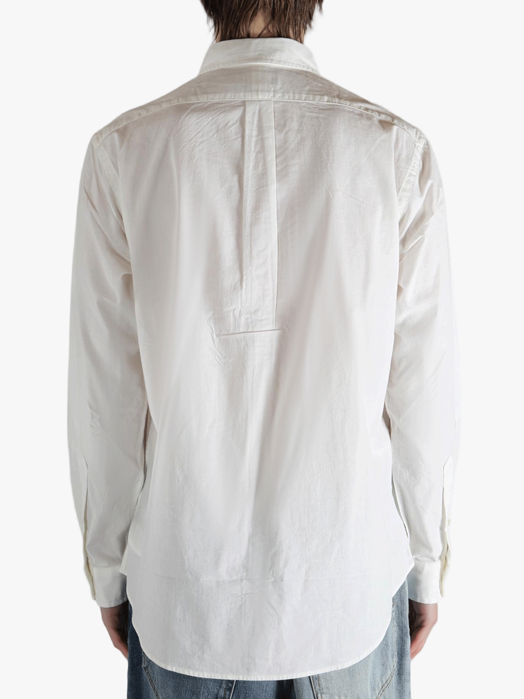 White shirt worn by a person, showing the shirt's fit