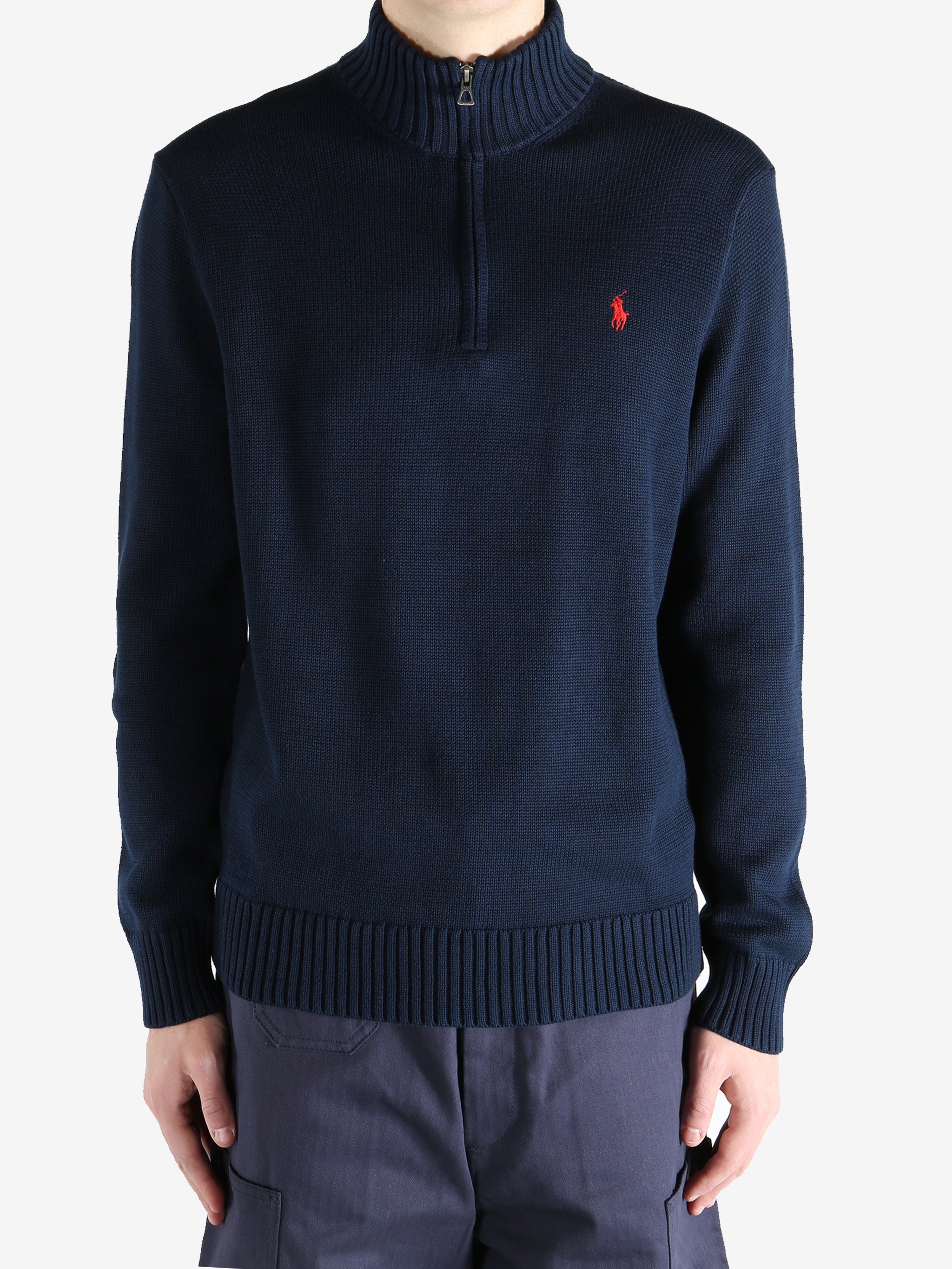 Navy shirts worn by a person, showing the shirts fit