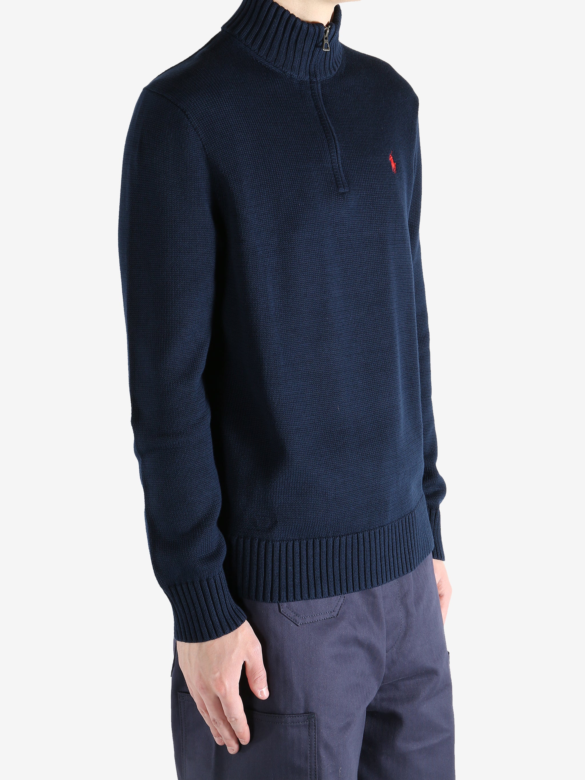 Navy shirts worn by a person, showing the shirts fit