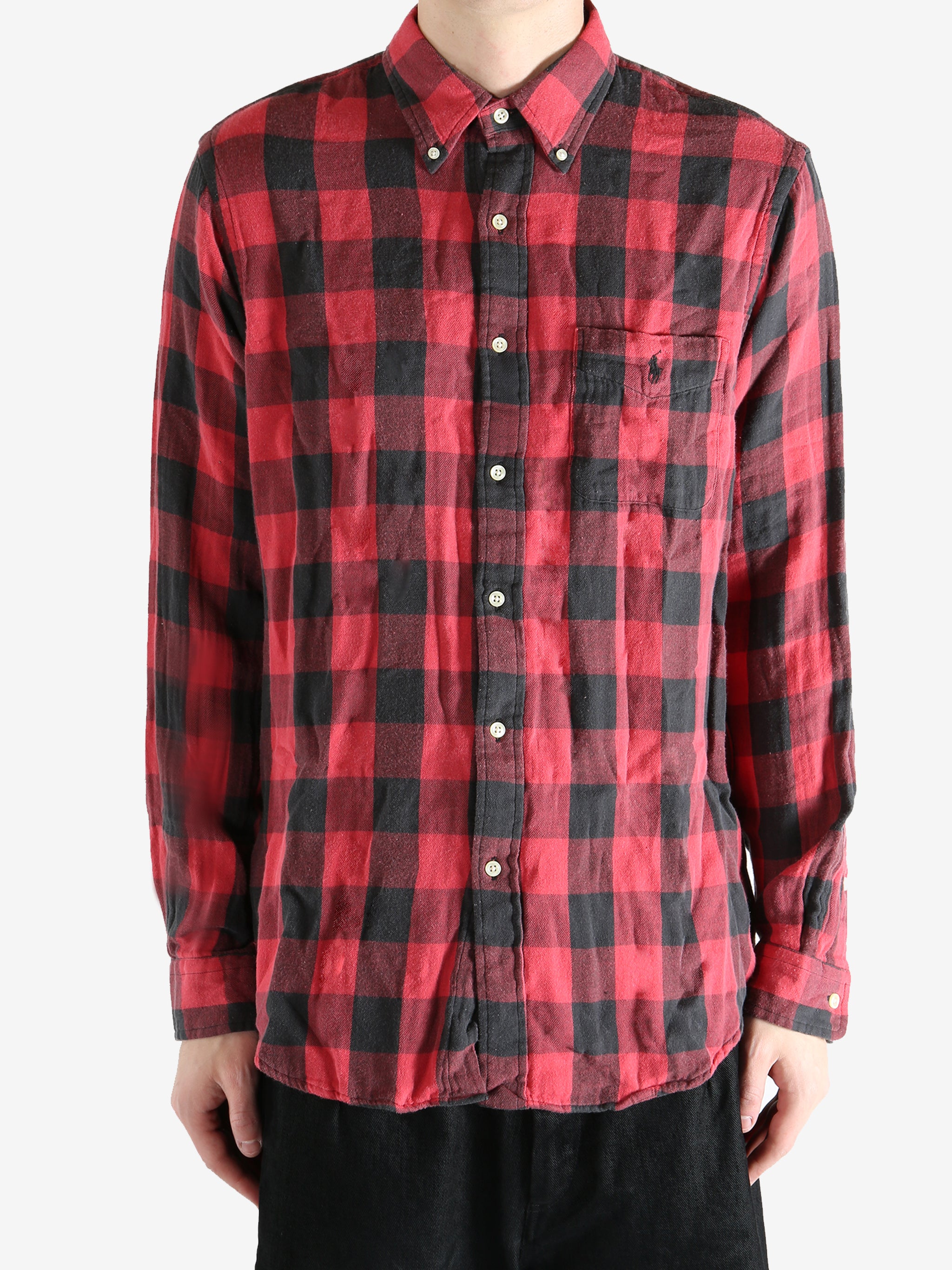 Red shirts worn by a person, showing the shirts fit