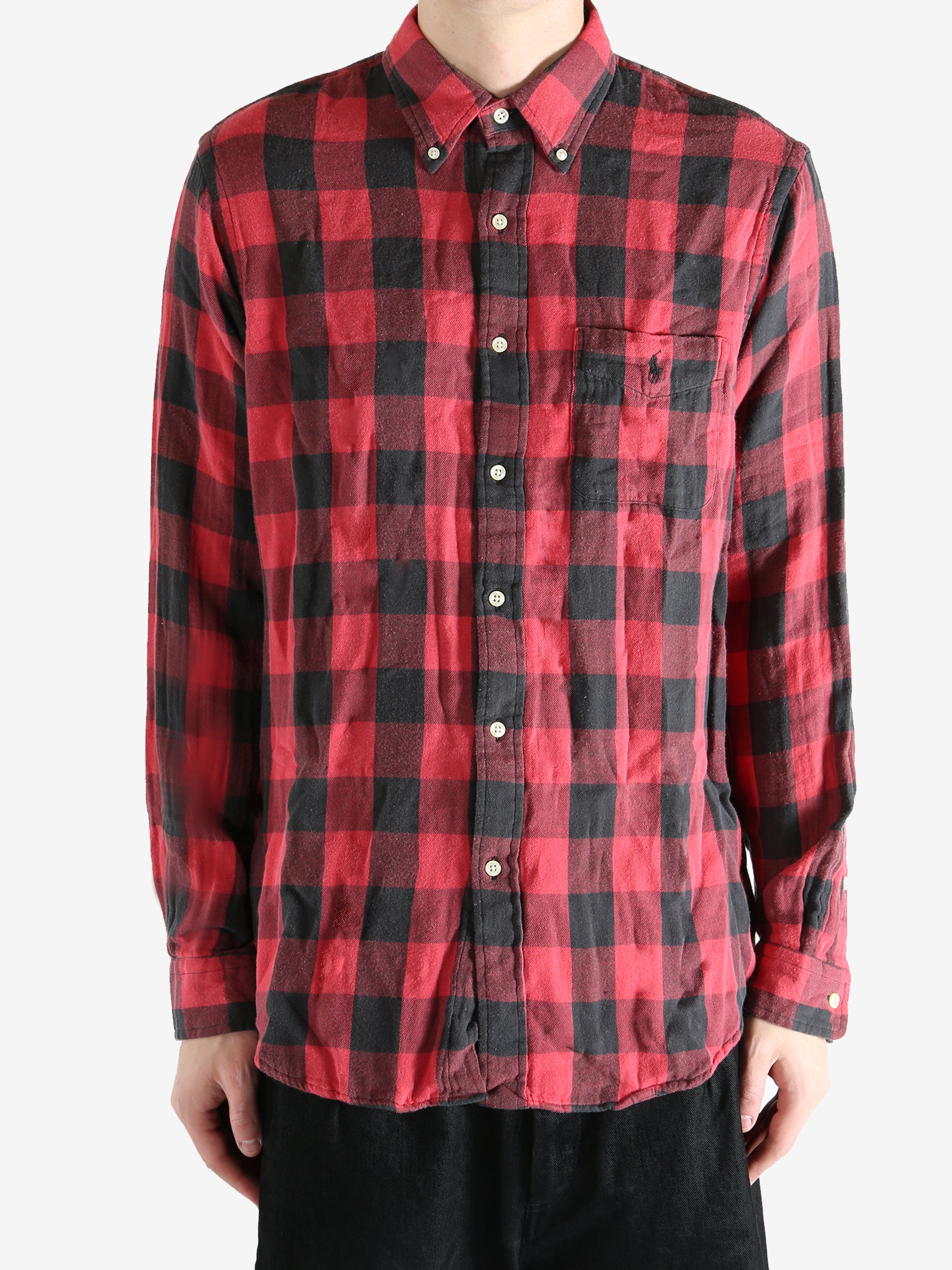 Red shirts worn by a person, showing the shirts fit