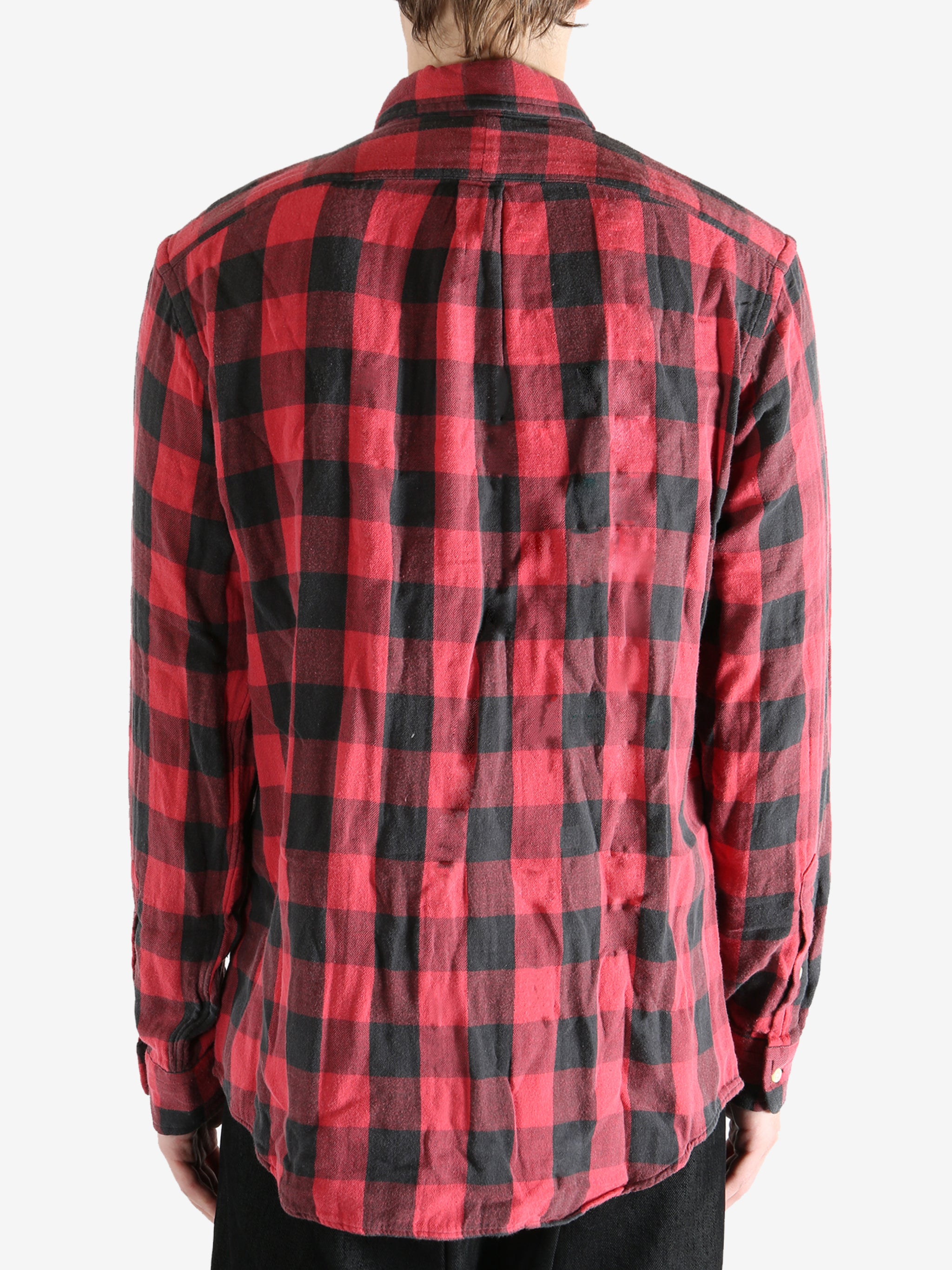 Red shirts worn by a person, showing the shirts fit