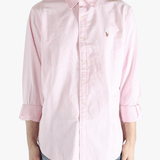 Pink shirt worn by a person, showing the shirt's fit
