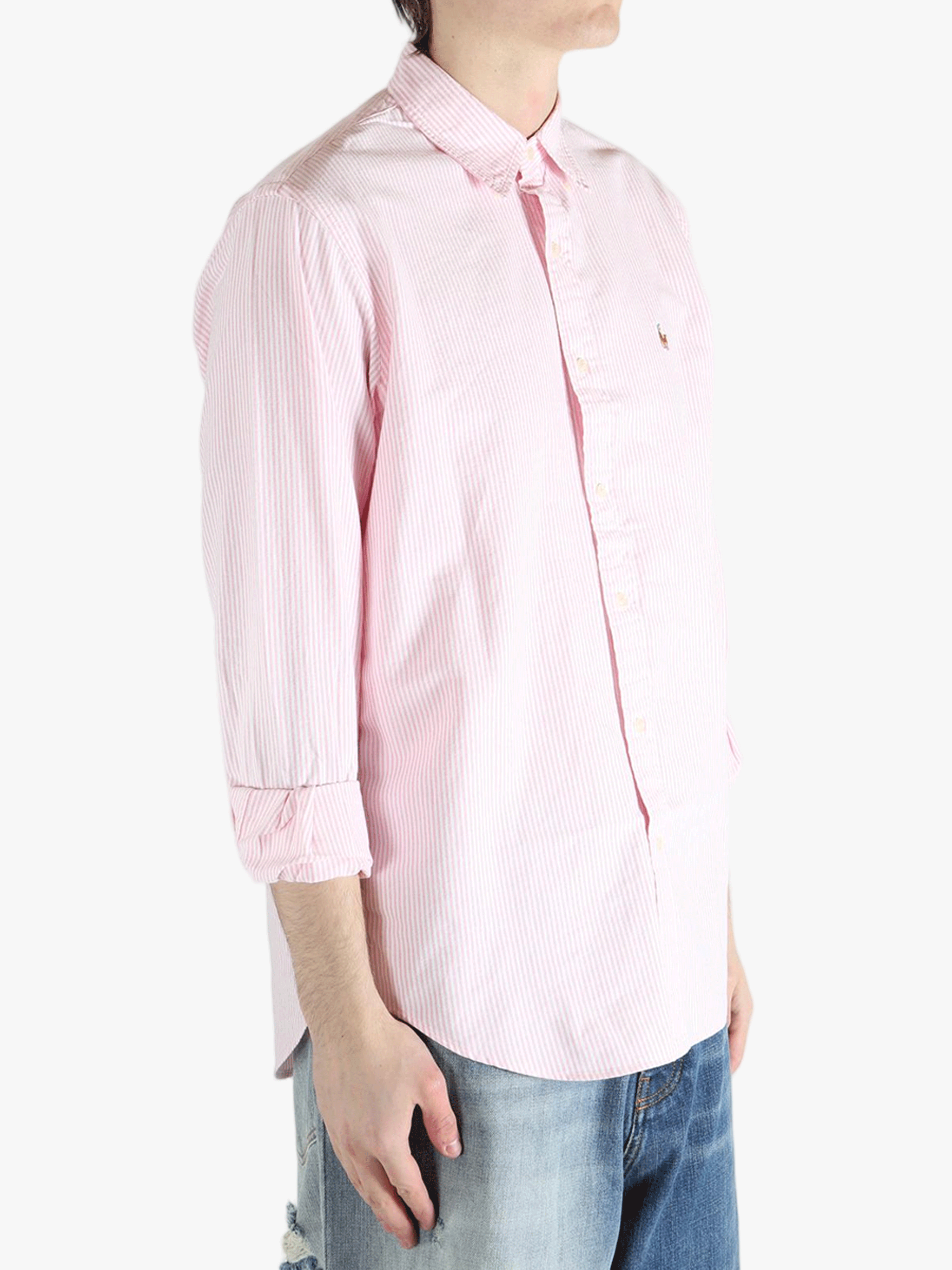 Pink shirt worn by a person, showing the shirt's fit