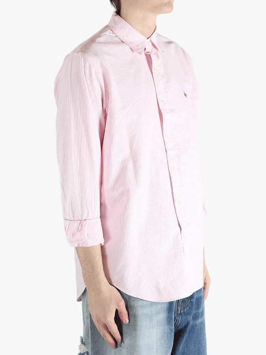 Pink shirt worn by a person, showing the shirt's fit