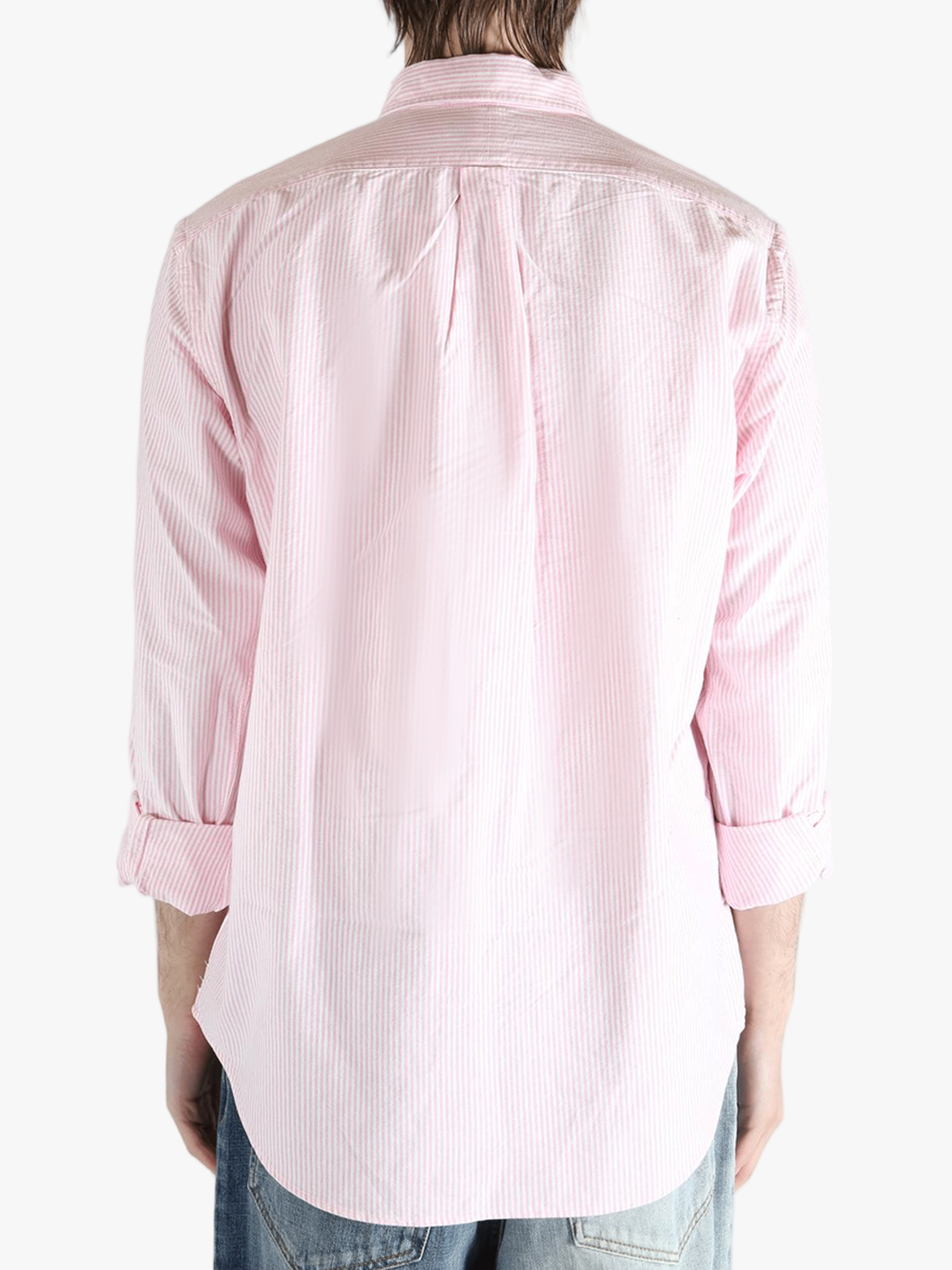 Pink shirt worn by a person, showing the shirt's fit