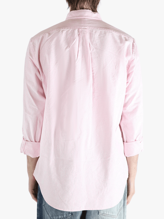 Pink shirt worn by a person, showing the shirt's fit