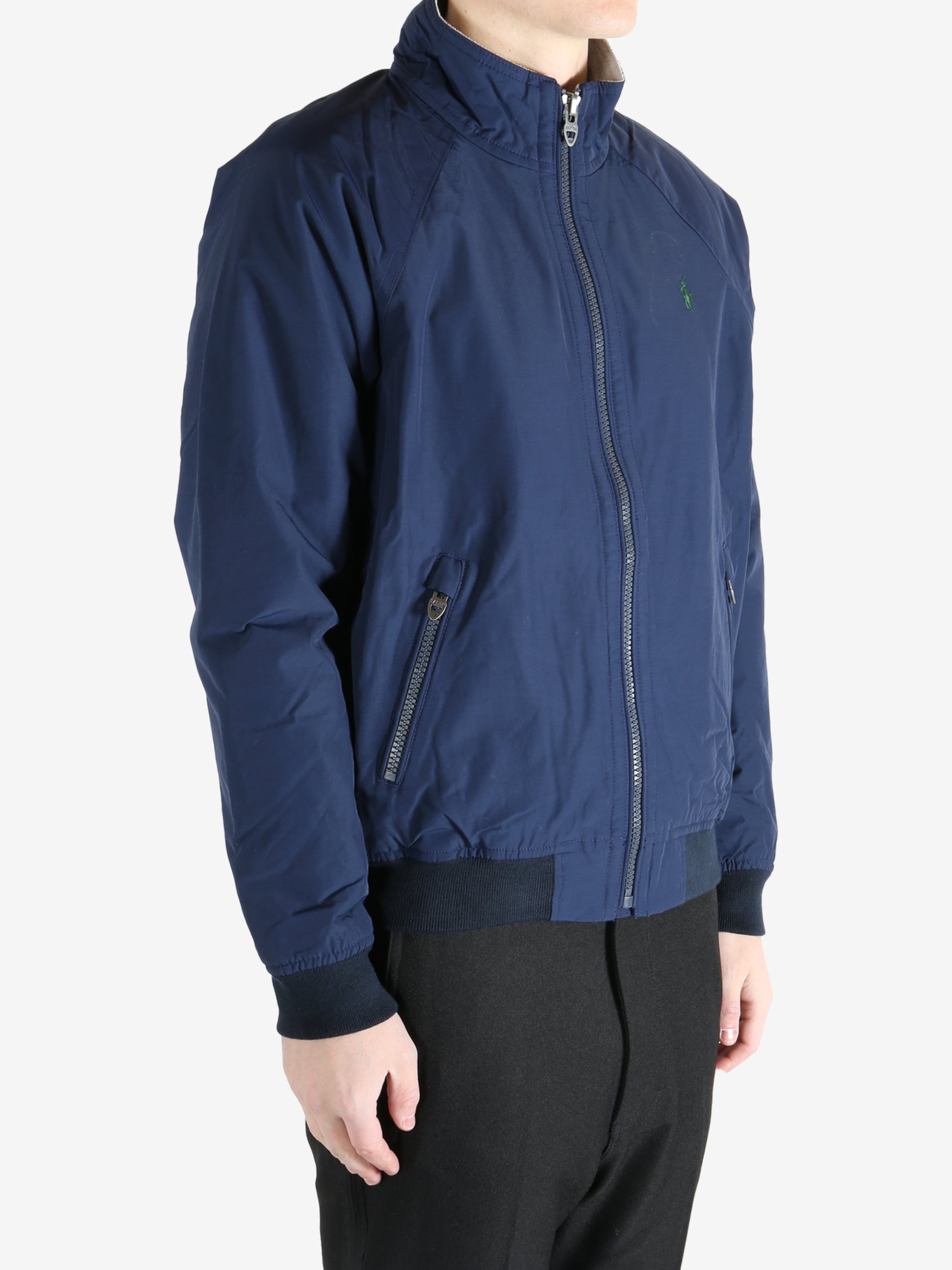 Navy jacket worn by a person, showing the  jacket fit