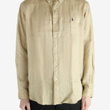 Tan shirts worn by a person, showing the shirts fit