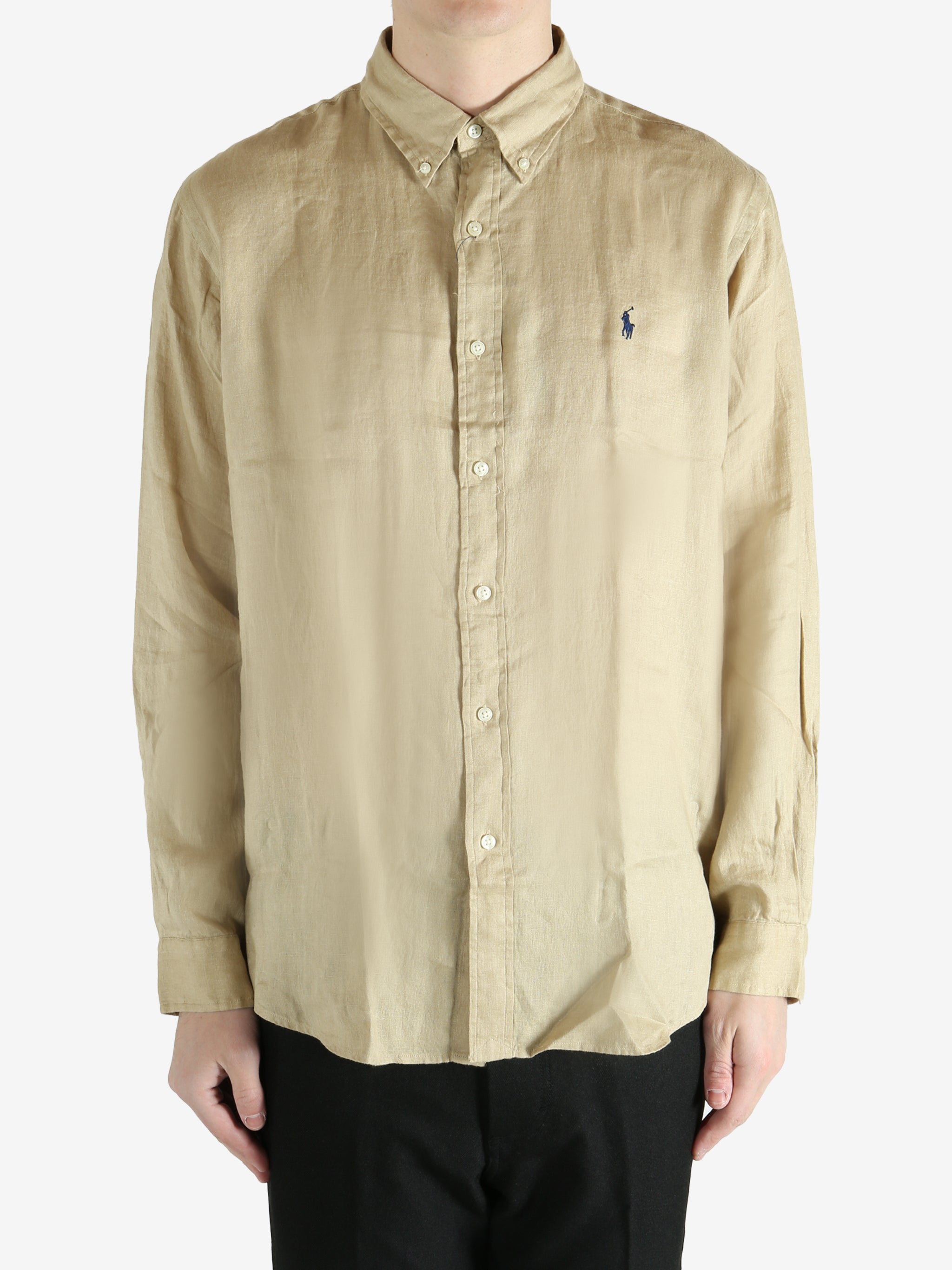 Tan shirts worn by a person, showing the shirts fit