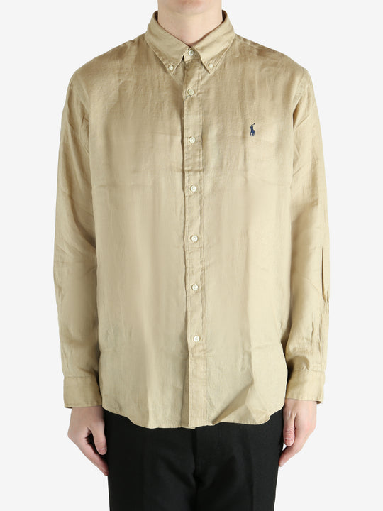 Tan shirts worn by a person, showing the shirts fit