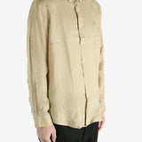 Tan shirts worn by a person, showing the shirts fit