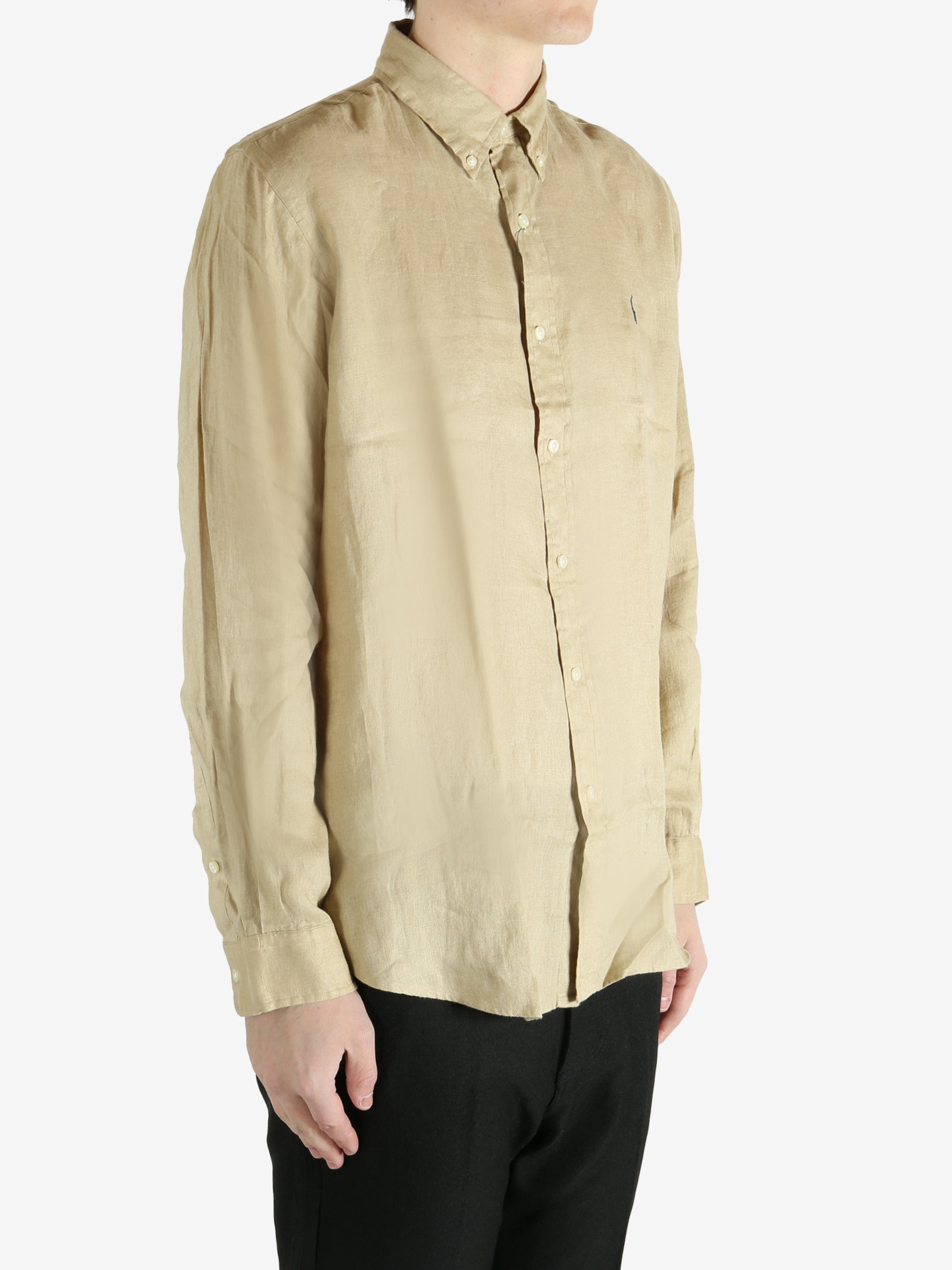Tan shirts worn by a person, showing the shirts fit
