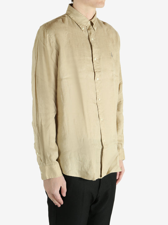 Tan shirts worn by a person, showing the shirts fit