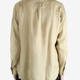 Tan shirts worn by a person, showing the shirts fit