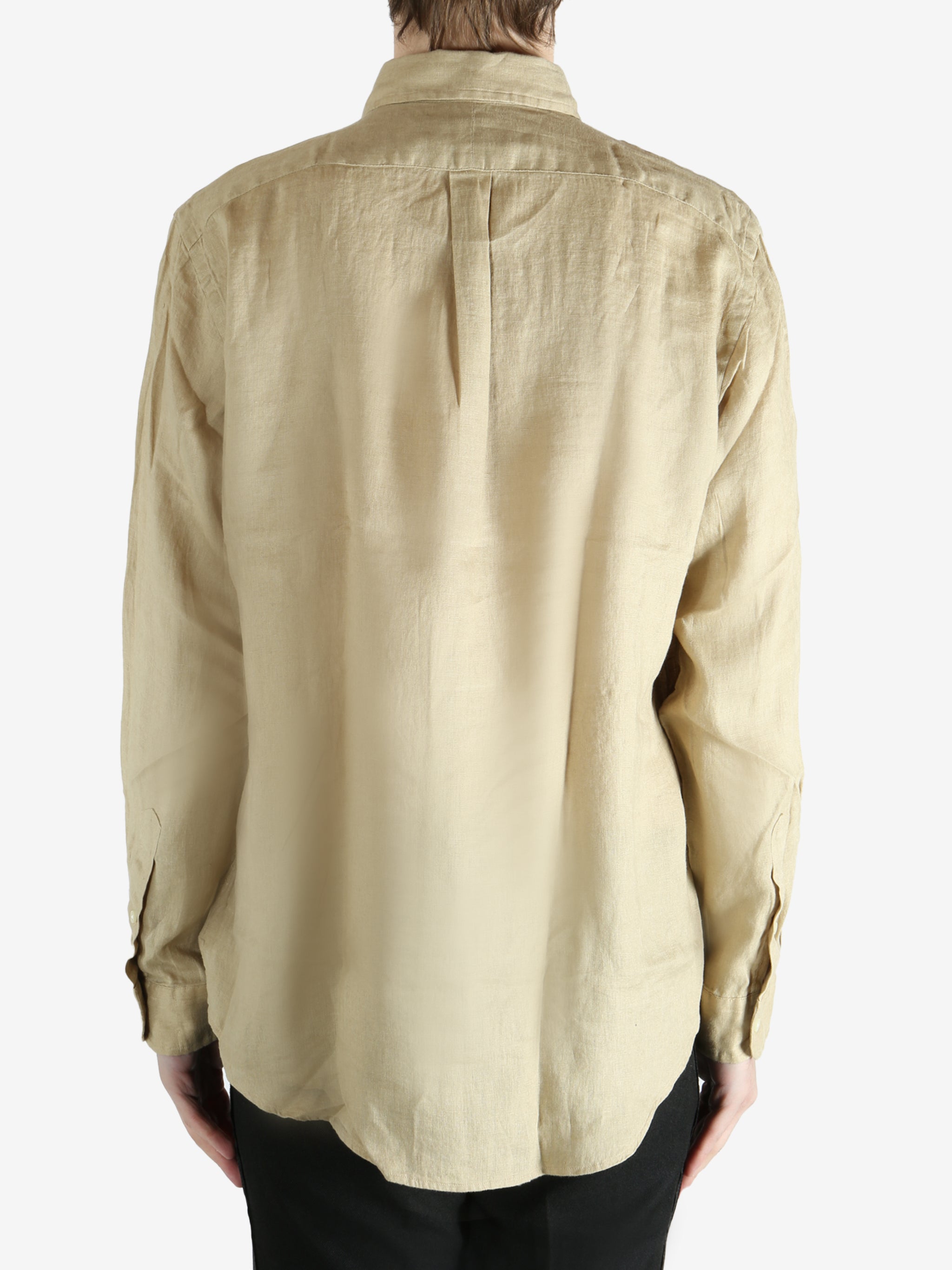 Tan shirts worn by a person, showing the shirts fit