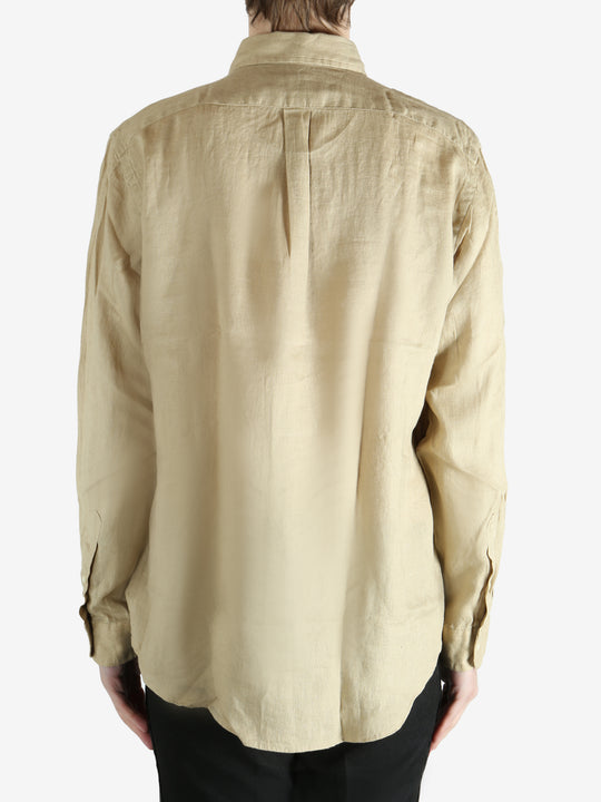 Tan shirts worn by a person, showing the shirts fit